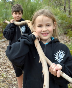Back to nature MRIS students Jett Higgins (Yr 6) and Amelia Glass(Yr 5) start collecting suitable material to build cubbies in the school grounds.