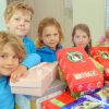 Operation Christmas Child at MRIS Reaching out: MRIS students, Sol, Finn, Evie, Fiona and Maisy with the Operation Christmas Child boxes.